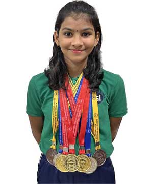 Dhanya Nataraj Naik of Grade 5 has won total 7 medals in Swimming 